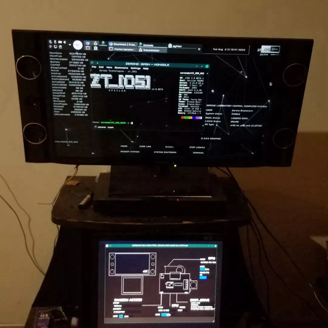 A monitor on a stand showing the ztOS desktop, with a second small screen below it